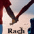 Two figures in red pants and dark shoes hold hands against a light background, with text below reading 'Rach && Brad made in Heaven'.