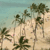 Pixelated static image of palm trees on a sandy beach under a light blue sky with scattered clouds.