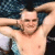 A split-frame image showing a shirtless person with arms raised on the left and bold red text repeating "Hey Baby" on the right, all in pixelated style.