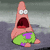 Pink starfish character with wide-open mouth and white eyes, wearing green shorts with purple patches, standing against gray background.
