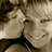 Pixelated image of two people embracing with one person smiling, surrounded by green pixelated text on a black background.