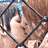 A 4-frame contact sheet of a pixelated animated icon showing two characters in various poses behind a chain-link fence and kissing, with text "T.A.T.U" and "Coolbuddy.com" below the frames.