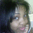 Pixelated close-up of a person with dark hair and light skin, showing partial facial features against a blurred background.