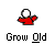A pixelated character in red clothing with a white head undergoes sequential animation changes against a gray background, displaying motion from full form to scattered fragments.