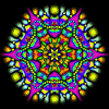 A circular mandala with vibrant purple, yellow, green, and blue patterns radiating from a central point on a black background.
