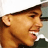 Pixelated image of a person wearing a white cap and dark clothing, with green text reading "CHRIS BROWN" on the right side.