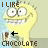 Pixelated yellow cartoon character with wide eyes and a broad smile, displaying text above and below the head.