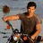 six pixelated images showing a man on a motorcycle, shirtless, and in close-up with text reading "Team Jacob" and "New Moon."
