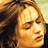 Static 48x48 pixel icon showing a close-up of a person's face with closed eyes, brown curly hair, and warm-toned skin rendered in low-resolution pixel art style.