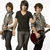 Three young men stand side-by-side holding guitars, with the central figure in a black shirt and gray pants, flanked by two others in gray shirts and dark pants.