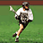 Pixelated image of a person running on grass with a lacrosse stick, next to red text reading "Nike just do it".
