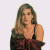 A pixelated image of a woman with long brown hair wearing a dark red dress, positioned next to green text on a white background.