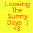 Yellow background with orange text reading "Loving The Sunny Days :) <3" arranged in four identical quadrants, each containing the same text and heart symbol.