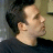A 48x48 pixel animated contact sheet showing three frames of a movie scene with two men and text reading "jersey girl" in blue lowercase letters on white background.