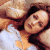 A pixelated image of a person with dark hair lying down, wearing white clothing, next to green text reading 'Original Icons .com' on a solid background.