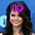 Four pixelated show a woman with long dark hair, a blue heart symbol, and text overlays including "I❤", "Wizards of", "Waverly", and "Place!"