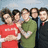 Group of five people standing together on left, red background with green text 'I Love MCS!!!' on right.