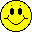 Yellow circular face with black eyes and a smiling mouth, some versions show red tongue extending from the mouth.