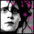 Pixelated grayscale face with pink floral background, showing subtle facial expression shift