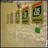 A pixelated image shows a of four vertical objects with red tops and green centers, a green square below them, and green text reading "Stand Out."