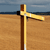 A pixelated static image shows a wooden post with a yellow arm extending horizontally, set against a brown ground and blue sky background.