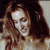 A pixelated image of a woman with long brown hair and light skin, next to green text reading "Original Icons .com" on a dark background.