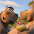 A pixelated cartoon horse with a brown coat and black mane stands on a grassy hill under a blue sky with white clouds, holding a small pink flower.