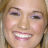 Static 48x48 pixel icon showing a close-up of a smiling person's face with light skin, brown hair, and visible teeth.