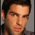 A four- shows a person with dark hair and light skin in a gray shirt against a light gray background, with subtle facial expression changes