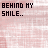 Pixelated text displays 'BEHIND MY SMILE..' and 'ARE STORIES YOU MAY NEVER UNDERSTAND.' with color variations