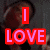 A pixelated image shows a person holding a drink with text overlays; the word "I" appears in red above "LOVE" in pink, while "JESSICA" is displayed in pink on white.