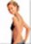 Pixelated image of a shirtless person with light brown hair standing in profile, facing left, against a light background.