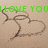 Green text reads 'I LOVE YOU PARKER!!!!!' above two brown heart-shaped speech bubbles on a beige background.