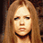 Pixelated image of a person with long light brown hair on left, bright magenta background with black text fragments.