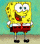 Yellow sponge character in red shorts and white shirt with red tie, standing against teal background with beige floor.