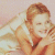 A pixelated image of a person with light brown hair lying on a bed, next to green text reading 'Original Icons .com' on a dark background.