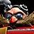 Pixelated close-up of a character with dark hair, blue eyes, and red lips wearing sunglasses against a blurred background.