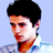 Static pixelated image of a person's head and shoulders with short black hair, light skin tone, red lips, and blue clothing against a light blue background.