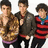 Three individuals stand side-by-side against a white background, each wearing distinct clothing with visible color patterns and textures.