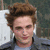 A pixelated image of a person with brown hair wearing a dark jacket over a light shirt, with pink text reading 'GOTTA LUV HIM' at the bottom.