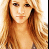 A pixelated image of a person with long blonde hair on the left, next to black background text reading 'Hilary Duffs #1 fan' in white font.