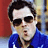 A pixelated image shows a person in sunglasses and blue clothing against a red background with '=O' text.