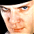 A 50x50 pixel animated contact sheet showing two frames of a Clockwork Orange-themed buddy icon with a character's face on the left and green text on the right.
