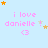 Light blue background with pink text reading "i love danielle !" and a pink heart symbol, surrounded by orange and white stars in various positions.