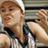 Pixelated static image of a person in sports attire holding a tennis racket, likely from an AOL Instant Messenger buddy icon set.