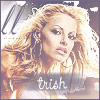 Pixelated image of a person with long wavy blonde hair, wearing a striped top and large earrings, with the text 'trish' overlaid at the bottom.