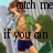 Pixelated image of a shirtless person with brown hair wearing dark blue shorts, standing outdoors with green foliage and light sky background.