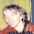 Two pixelated figures in red tops face left against a yellow and blue background with a vertical blue line separating them.