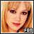 Pixelated image of a person with light brown hair and red lips, overlaid on pink background text reading 'fly open up the part of you' in black letters.