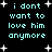 Pixelated cyan text on black background with white starbursts, displaying 'i dont want to love him anymore' in two identical vertical